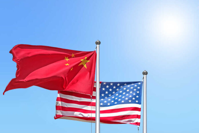 China,And,Usa,National,Flag,Waving,Against,Sunny,Blue,Sky